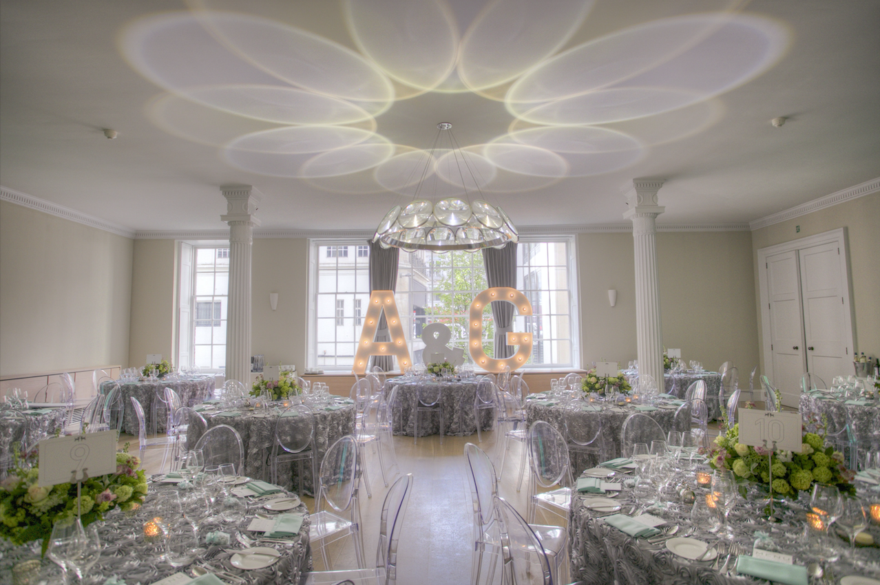 Elegant wedding venue at RSA House with silver tables and floral centerpieces.