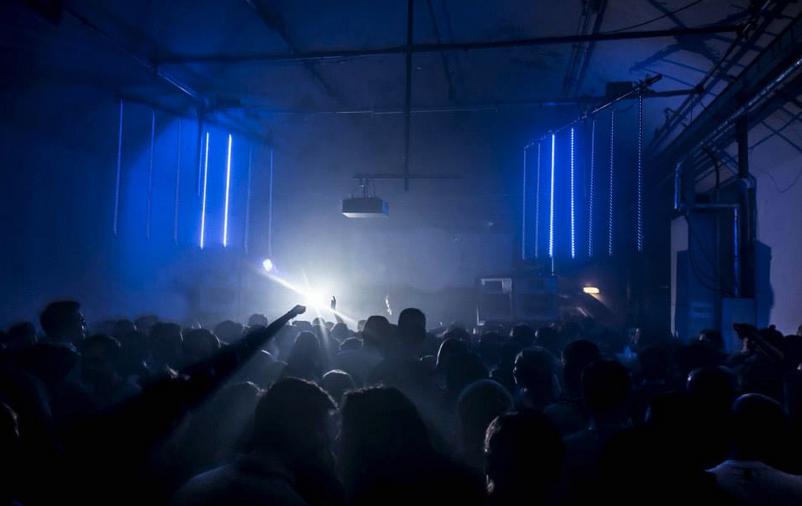 Vibrant event space with energetic crowd, ideal for concerts and nightlife.