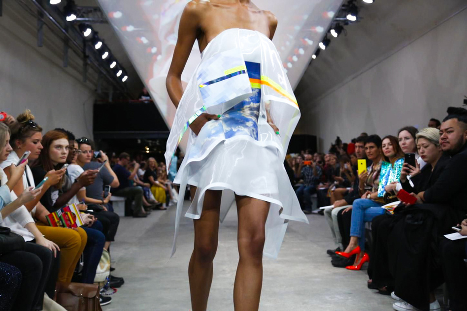 Dynamic runway scene featuring The Big Black One in striking attire at a fashion event.