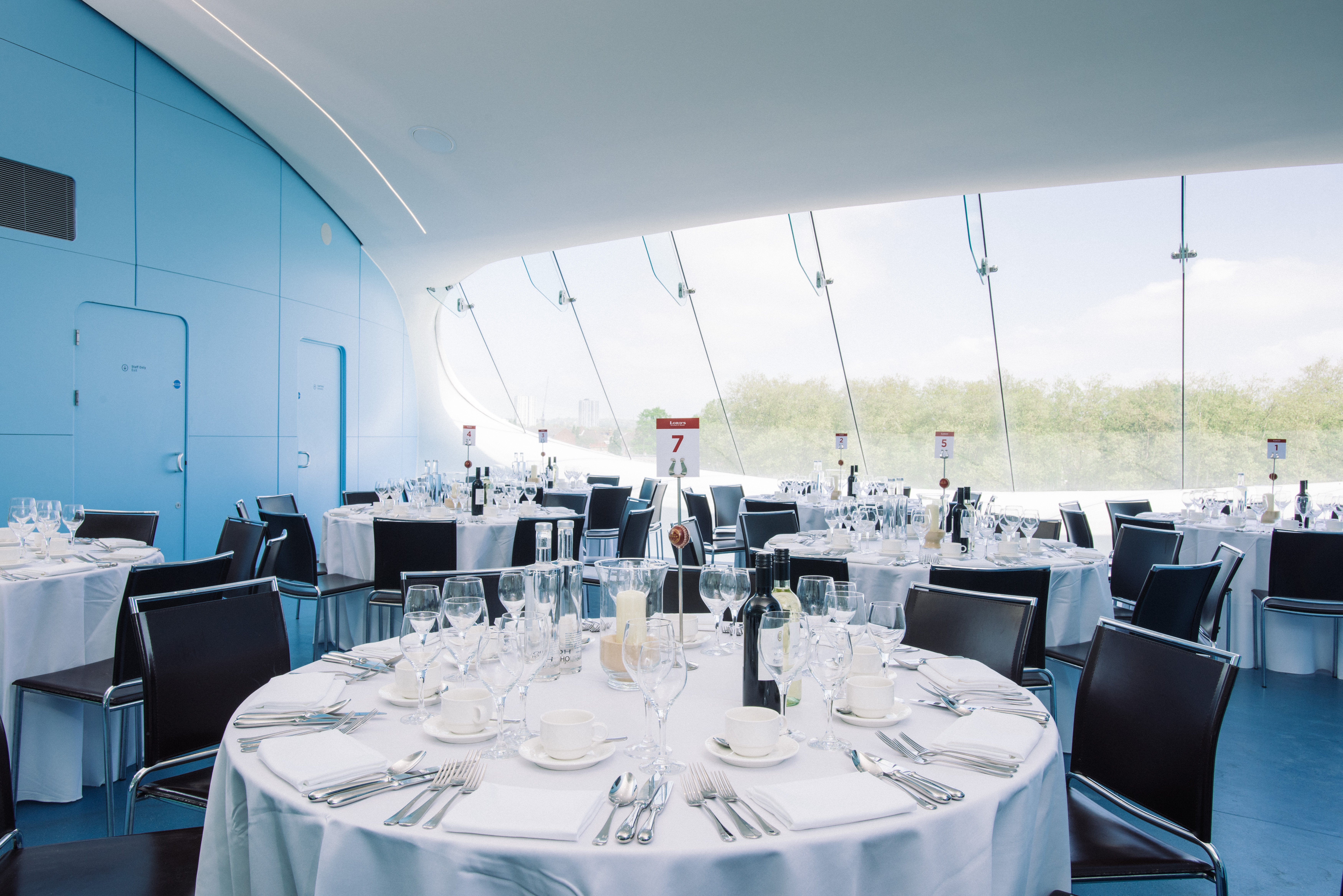 J.P. Morgan Media Centre at Lord's Cricket Ground, elegant dining setup for corporate events.