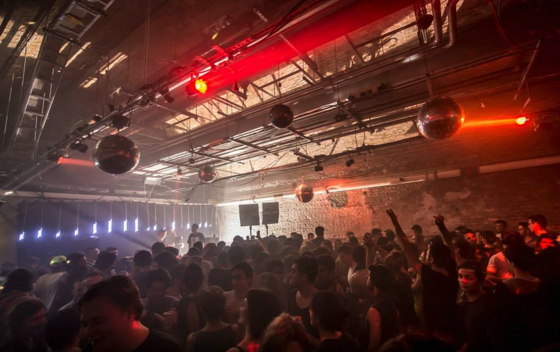 Vibrant event space with disco balls, ideal for nightlife and entertainment events.