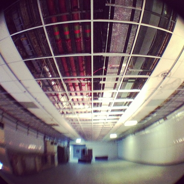 Unfinished ceiling in The Bricky One meeting space, highlighting event planning challenges.