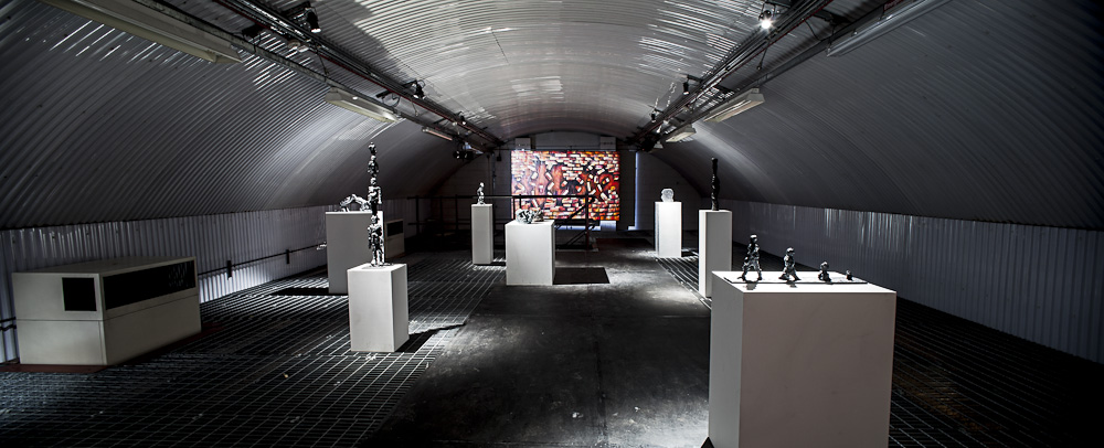Modern event space with sculptures in The Vaults, ideal for art showcases and corporate events.