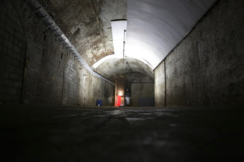 The Long Wet One venue: industrial underground space for immersive events and gatherings.