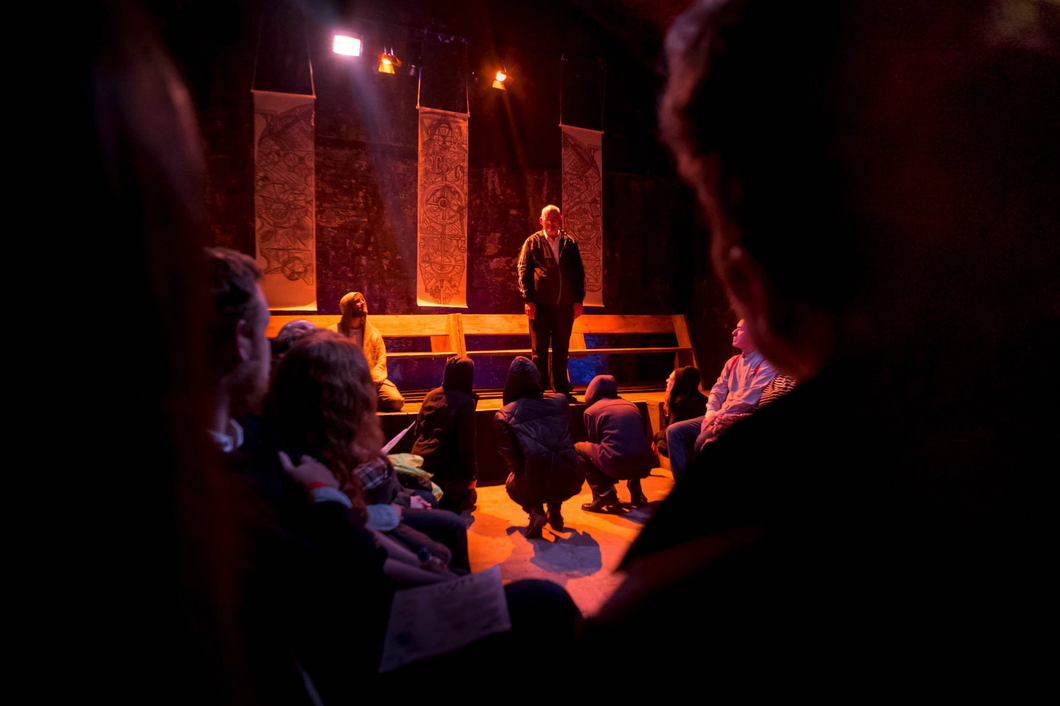 Engaging speaker at The Short Wet One workshop in warm, inviting lighting.