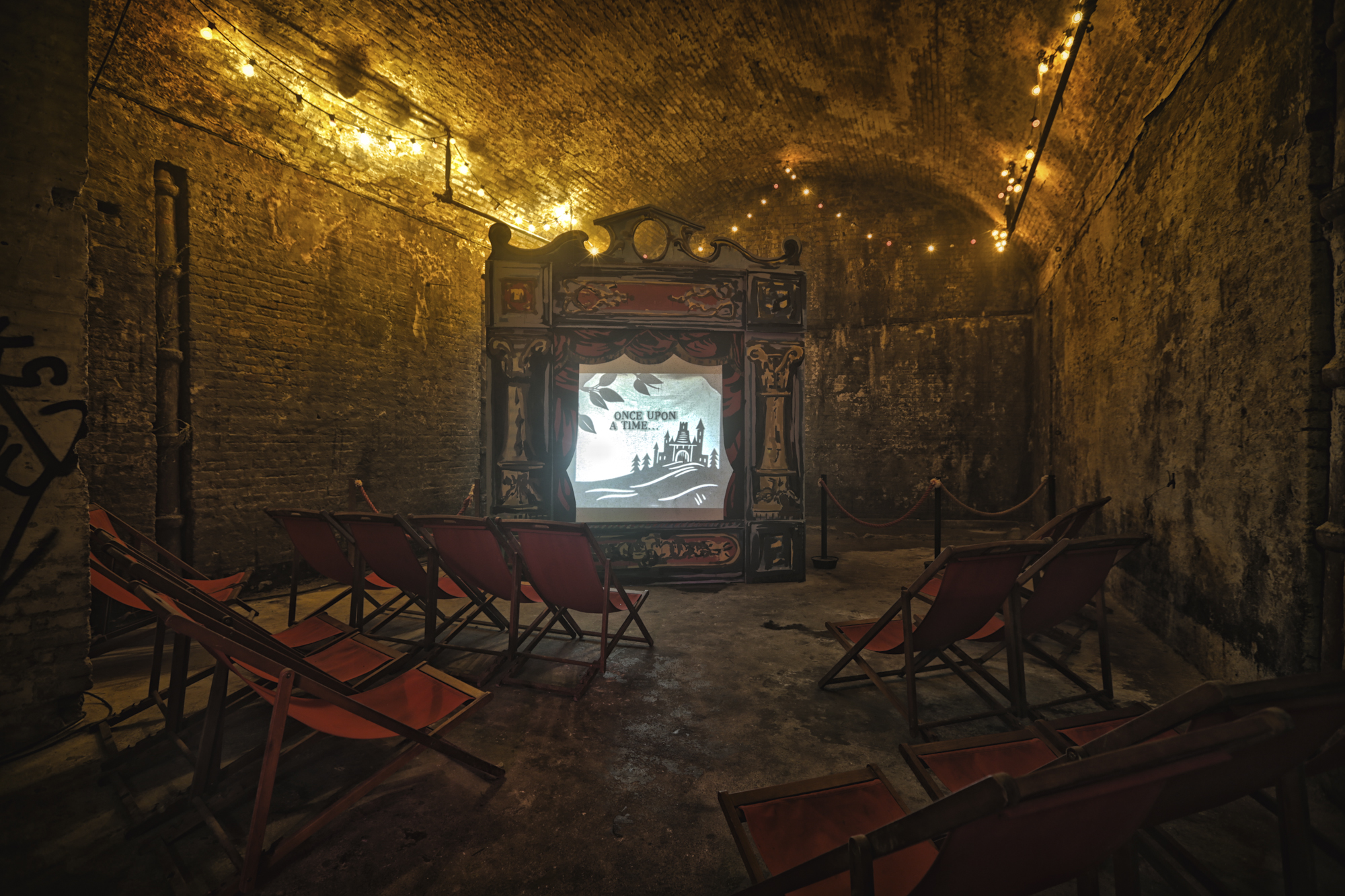 Intimate venue with vintage decor for creative events and workshops in The Vaults.