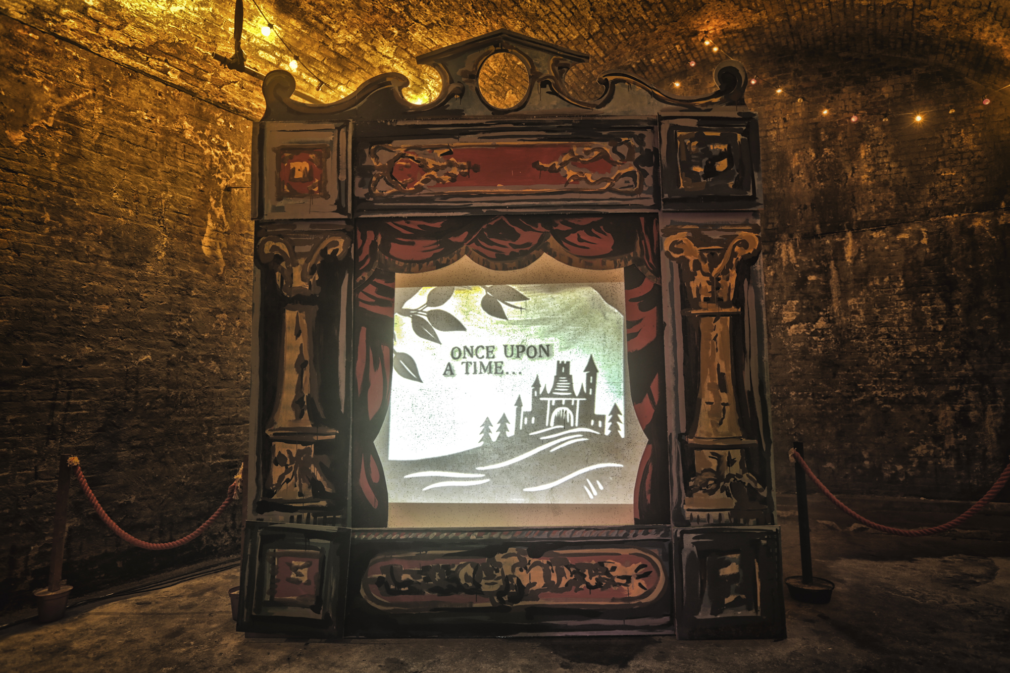 Whimsical vintage projection screen in The Vaults for immersive storytelling events.