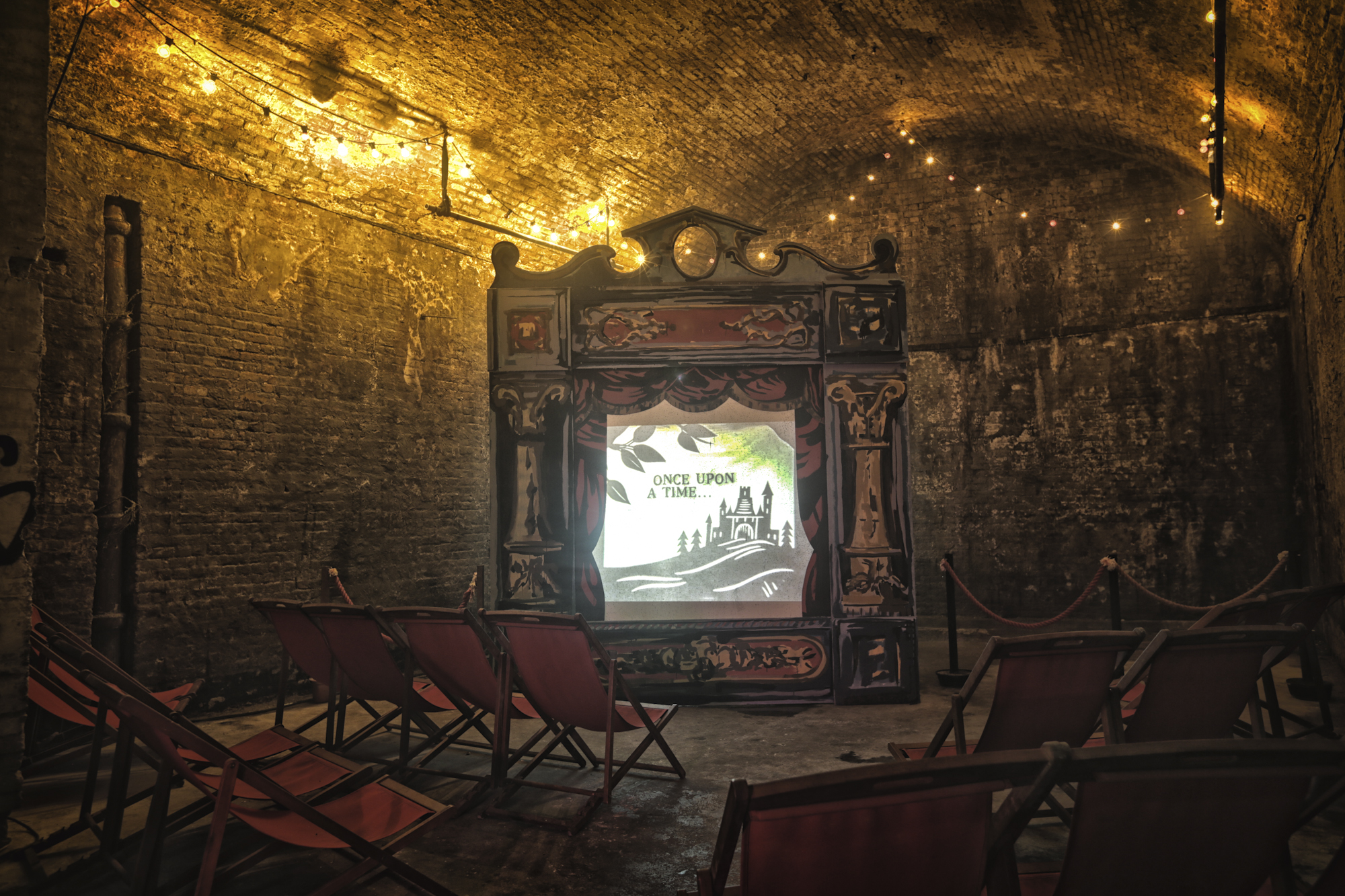 Vintage puppet theater in intimate event space for creative gatherings and storytelling.