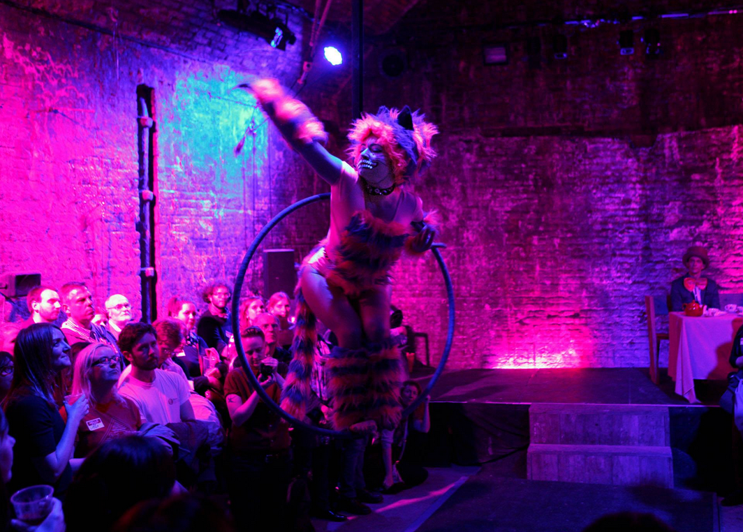 Vibrant performance space with dynamic hoop dancer for themed parties and corporate events.