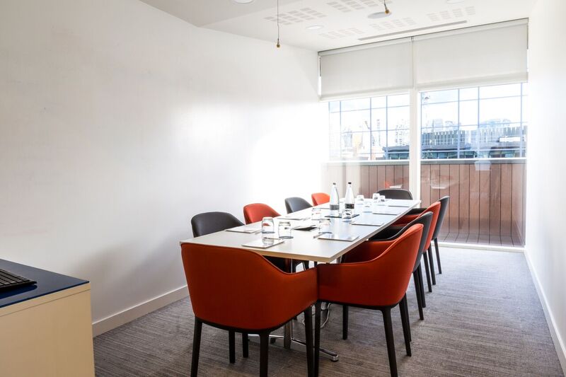 Modern meeting room at The Royal Pharmaceutical Society with natural light, ideal for collaboration.