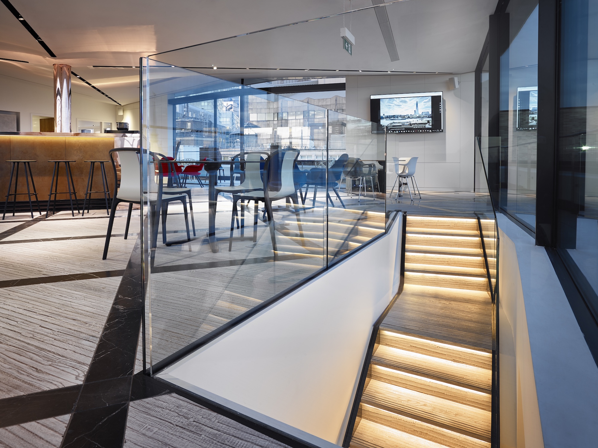 Modern Boardroom 2 at Us&Co Monument, ideal for meetings and events with elegant staircase.