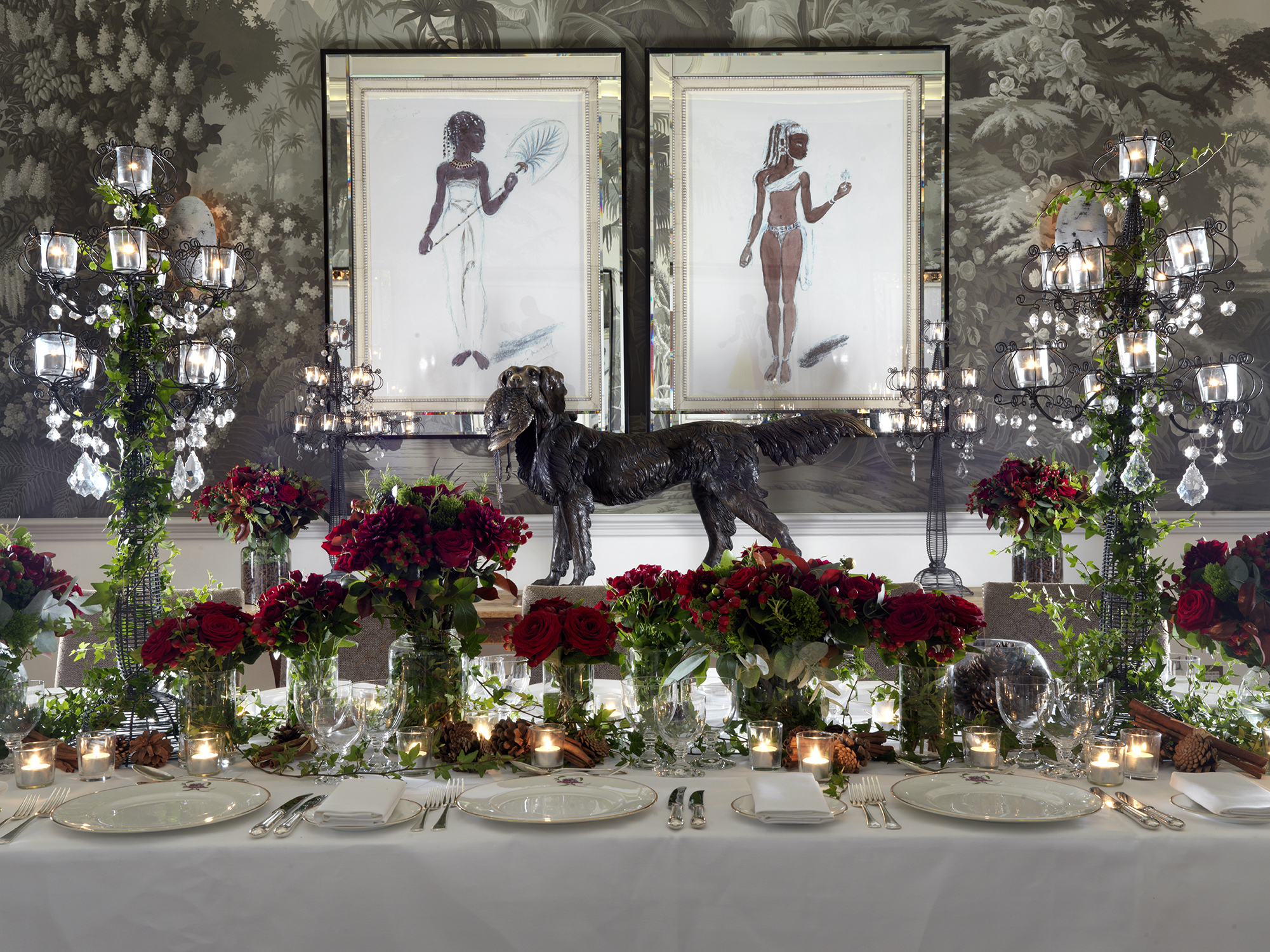 Elegant banquet table with floral arrangements and sculptural dog centerpiece at Haymarket Hotel.