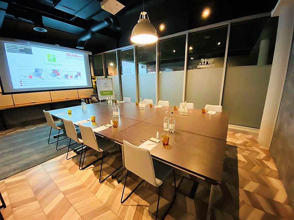 Whitechapel Think Factory meeting room with large screen, ideal for professional events.
