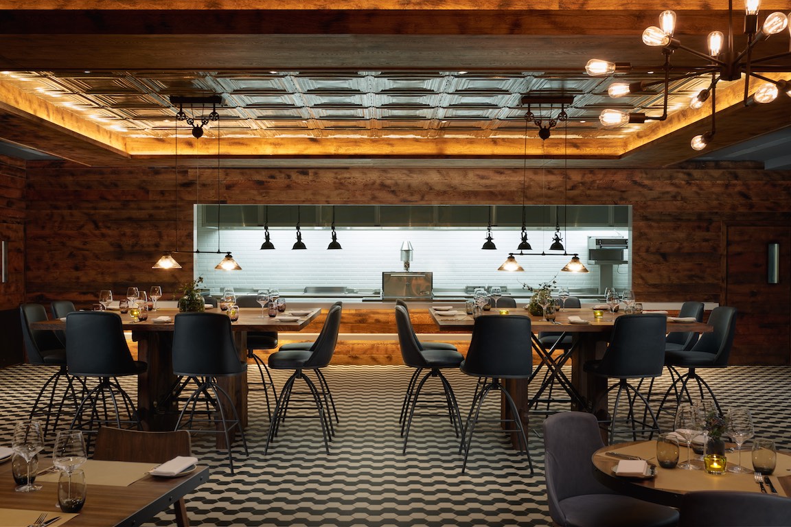 Modern dining space at OXBO Restaurant, Hilton London Bankside, ideal for events.