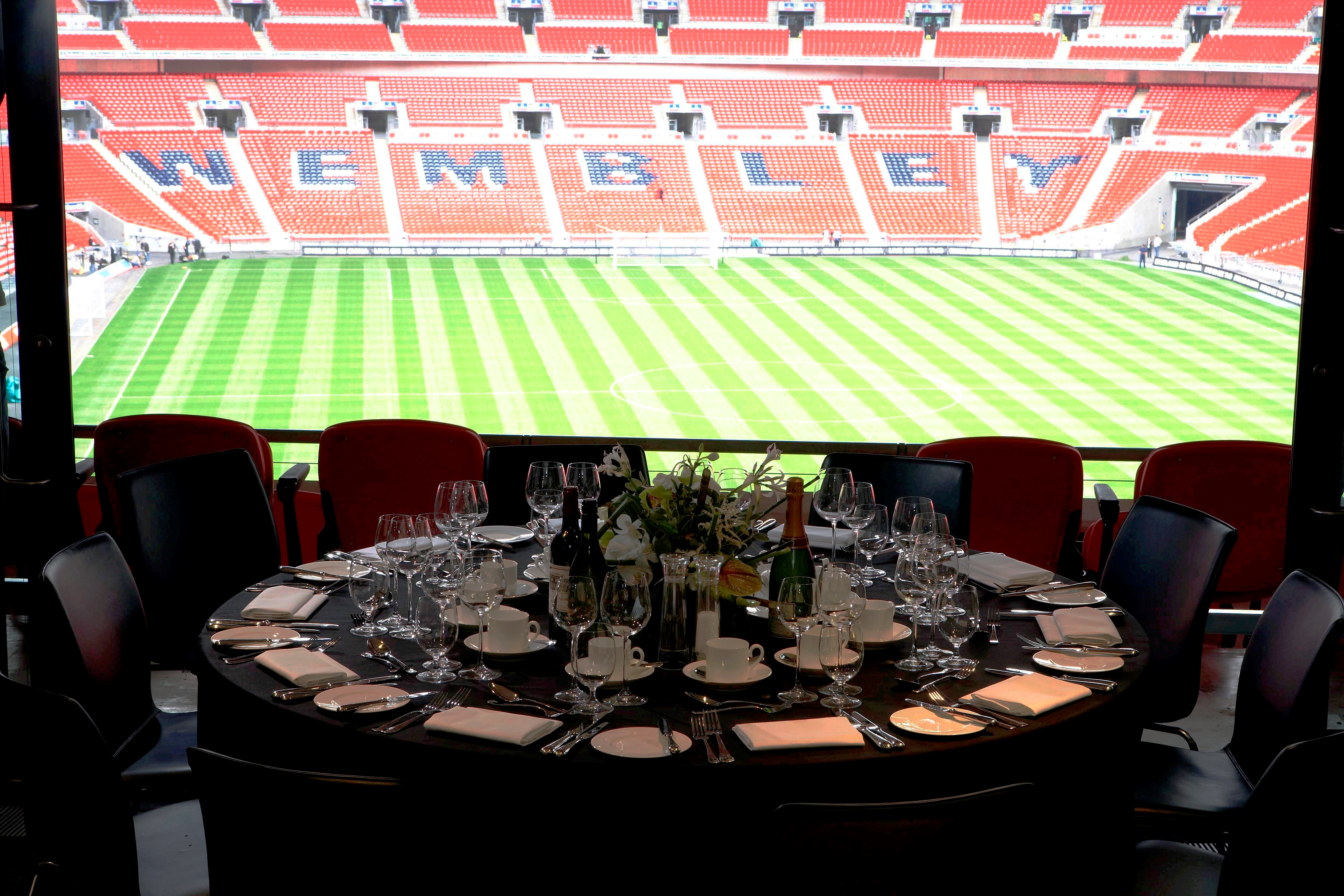 Pitch View Room at Wembley Stadium with elegant dining setup for corporate events.