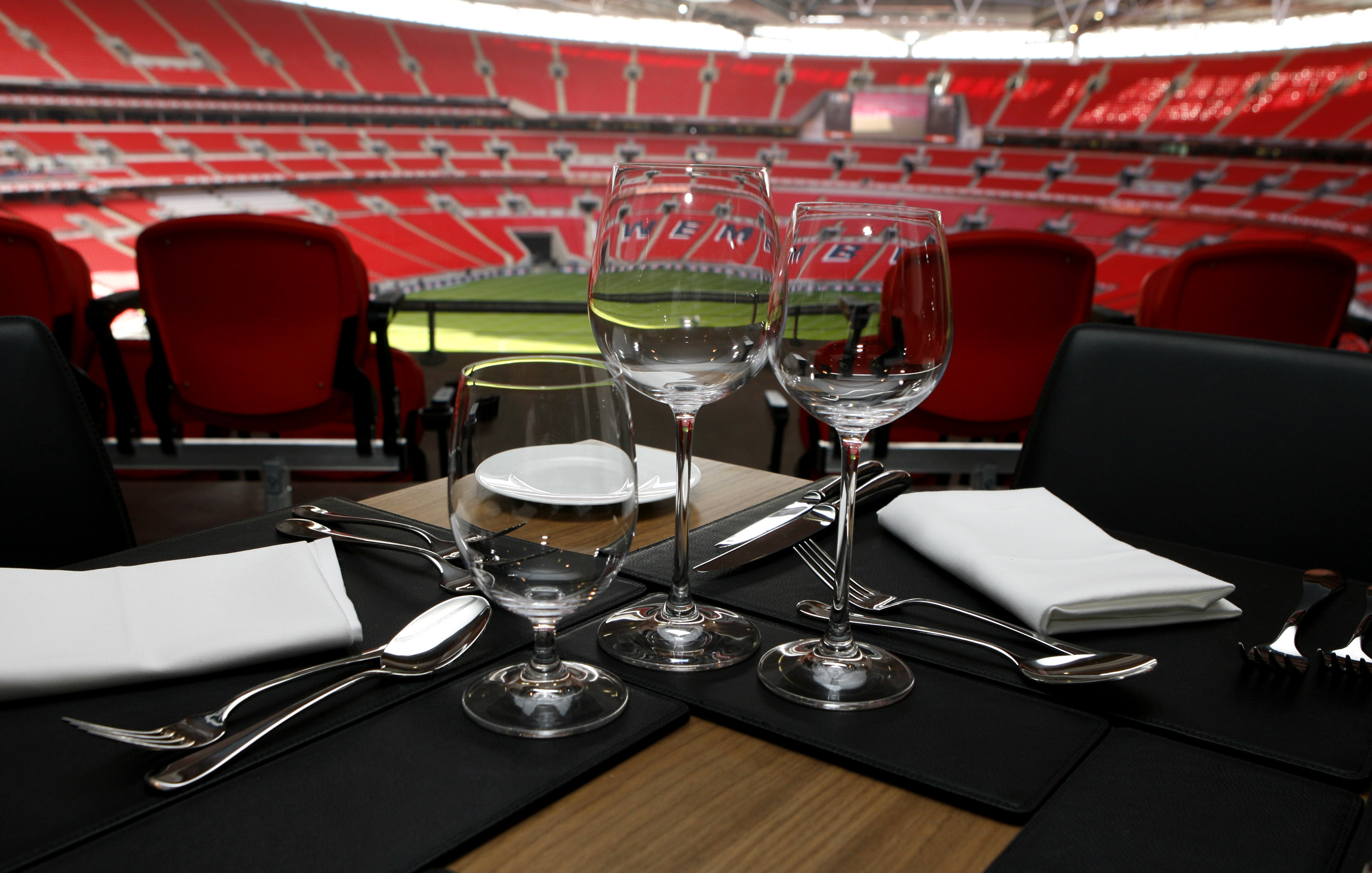 Pitch View Room at Wembley Stadium with elegant dining setup for corporate events.