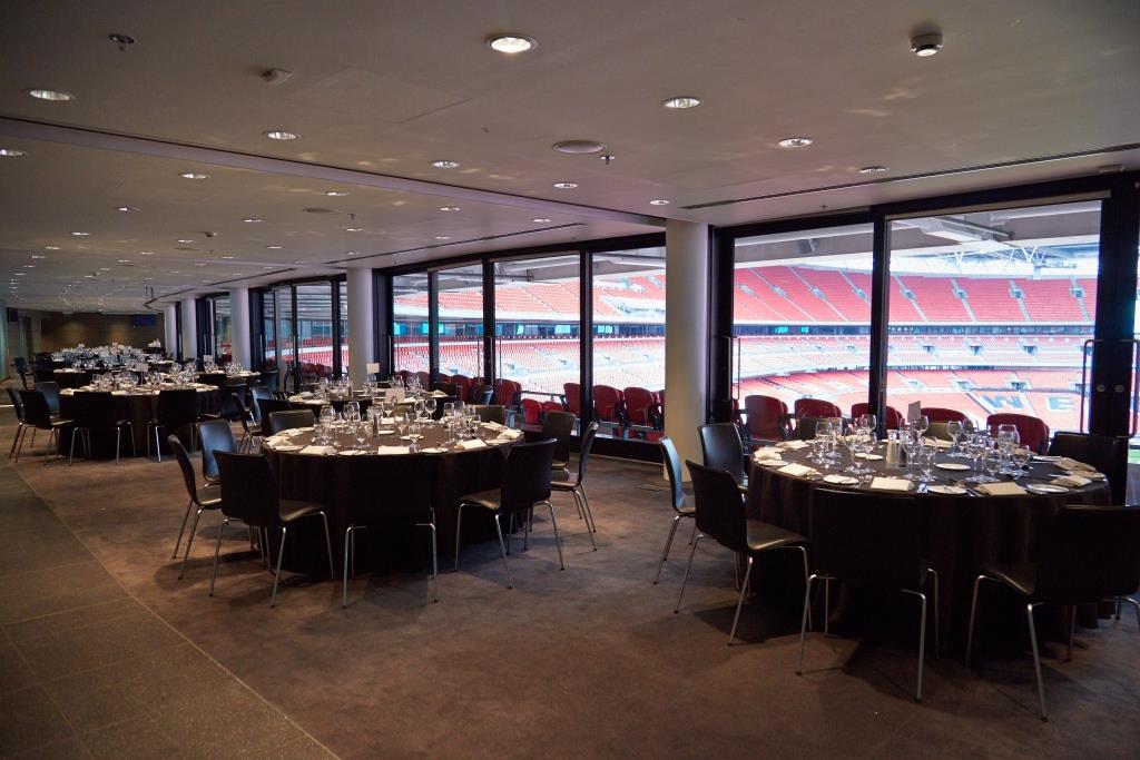 Pitch View Room at Wembley Stadium, elegant tables for corporate meetings and gala dinners.