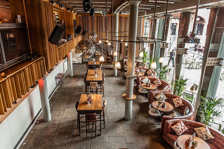 Stylish venue with cozy seating for meetings and events at Revolution Albert Dock.