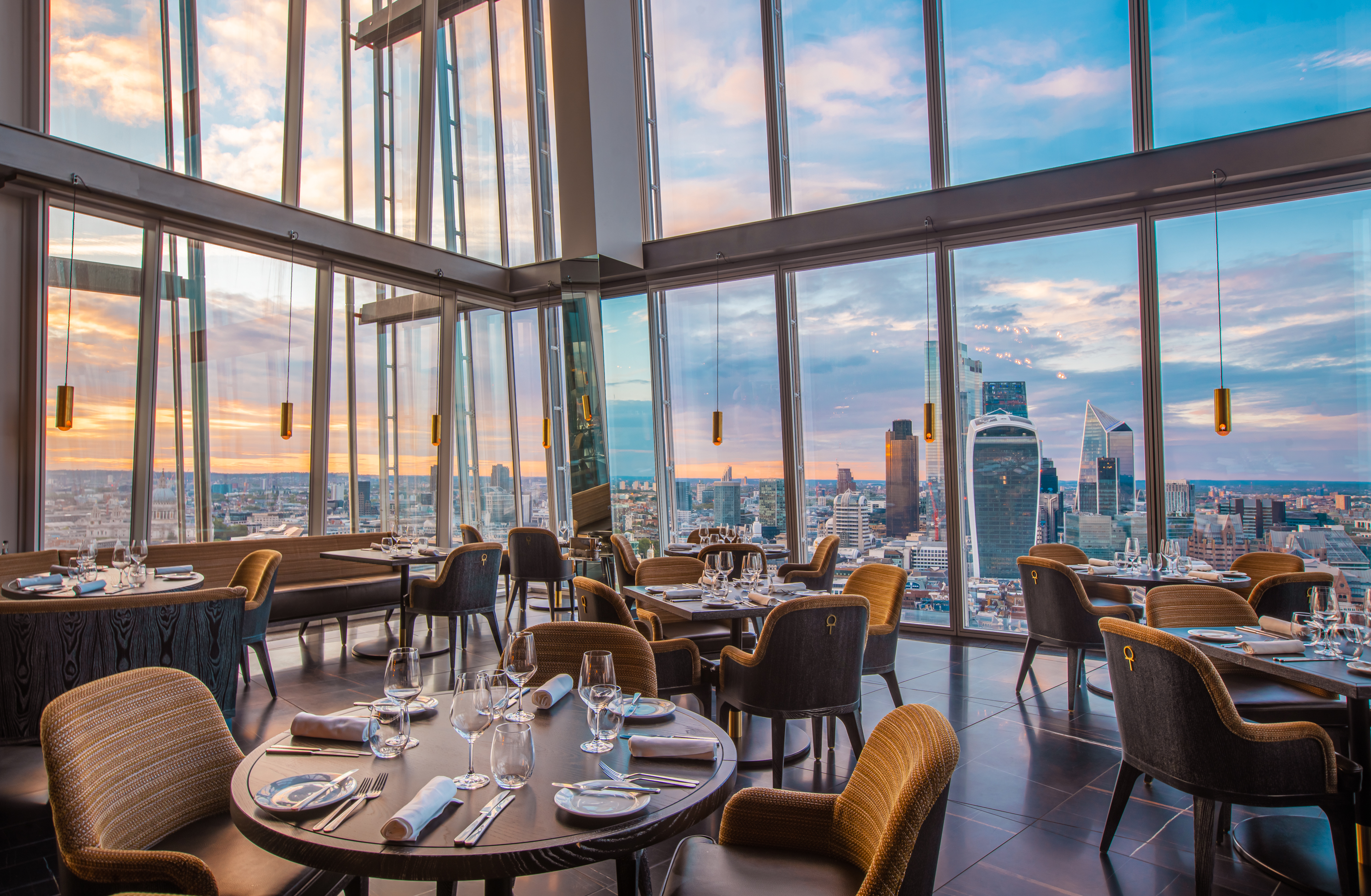 Sophisticated dining at Aqua Shard with panoramic city views for upscale events.