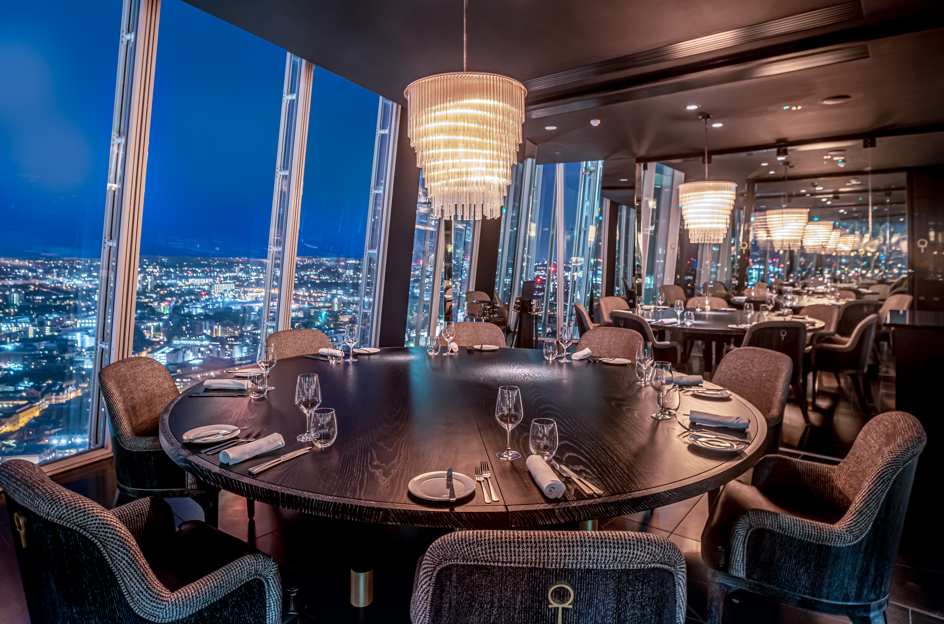 Elegant dining space at Aqua Shard with panoramic views for corporate events.