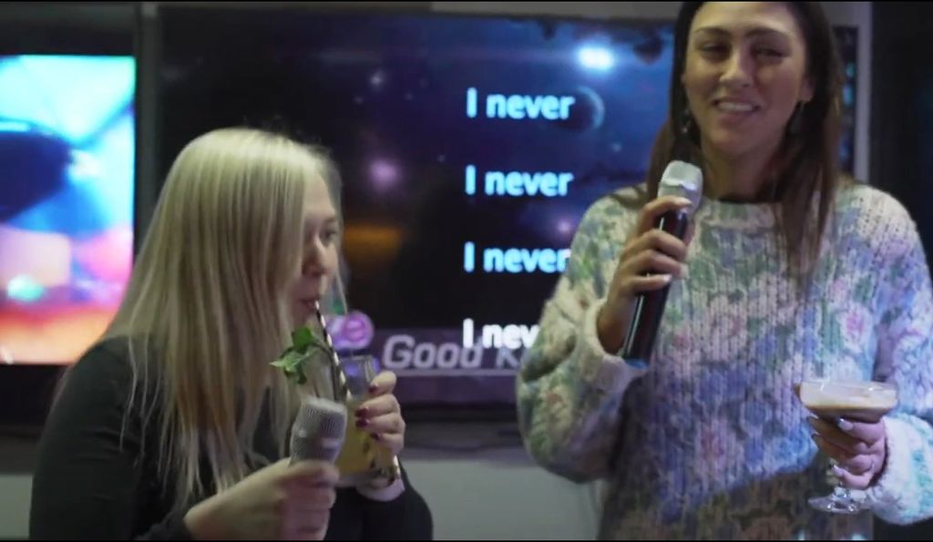 Attendees enjoying karaoke at Onyx Bar, Inamo Covent Garden during a networking event.