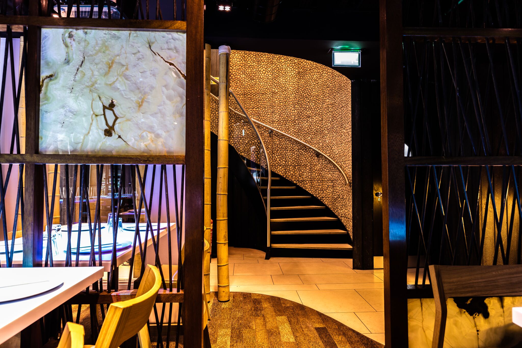Stylish Inamo Covent Garden restaurant with elegant staircase, perfect for upscale events.