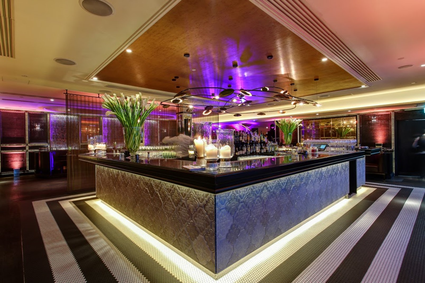 Stylish Aqua Nueva venue with sleek bar, ideal for upscale events and receptions.