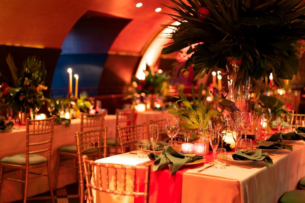 Elegant dining venue at Aqua Nueva with floral decor, ideal for weddings and galas.