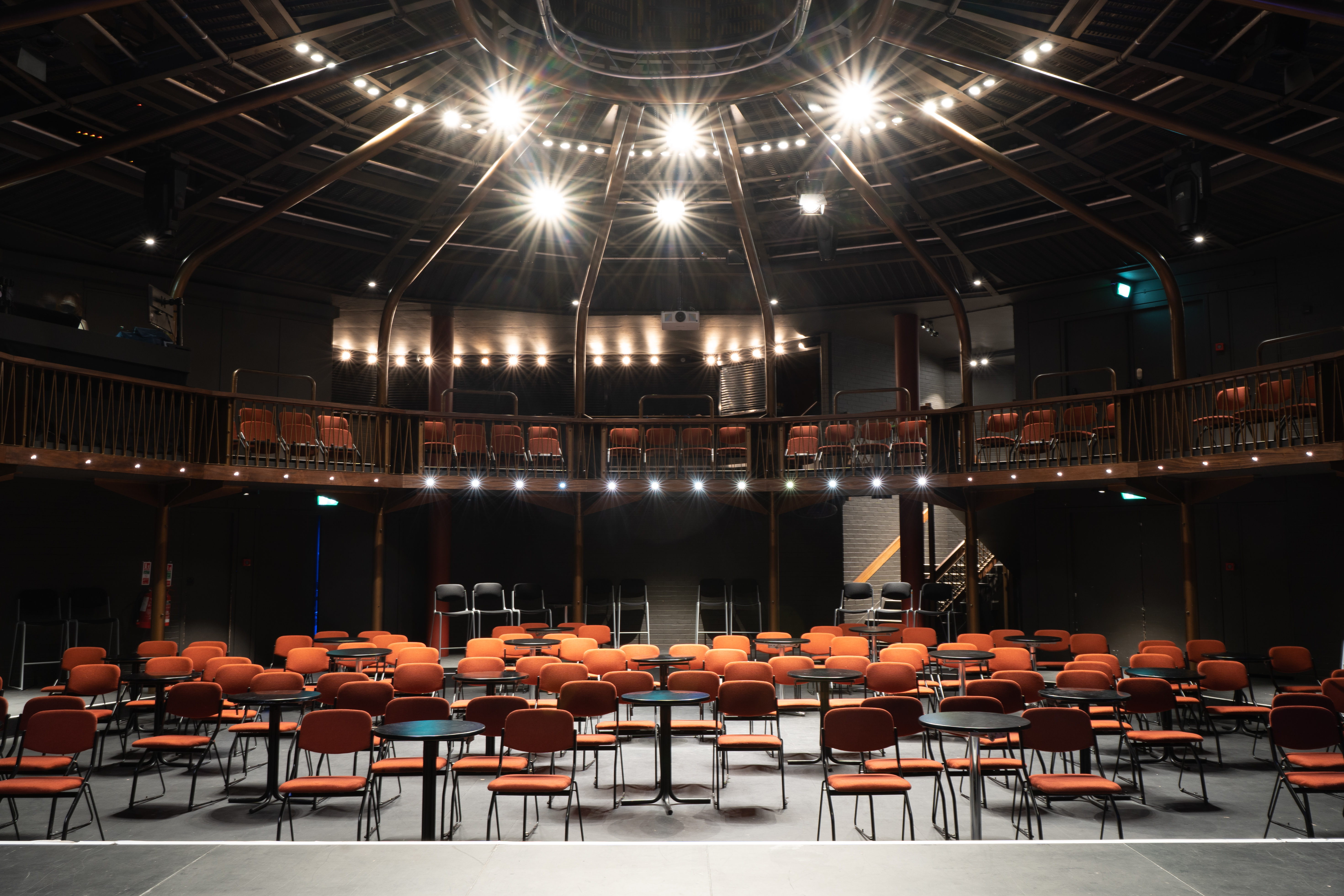 Theatre in The Albany with vibrant orange chairs for engaging events and presentations.