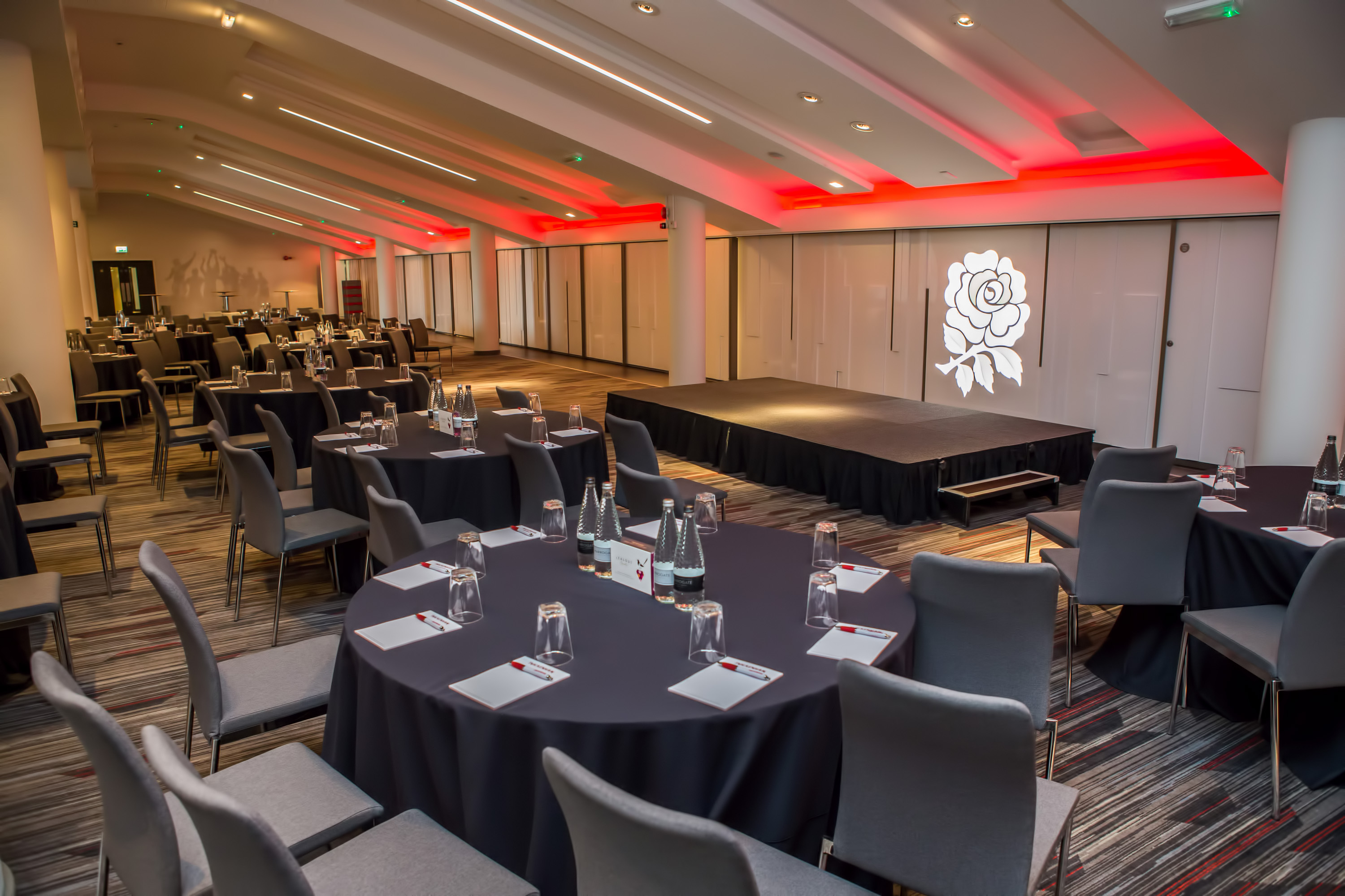 Event space at Allianz Stadium, Twickenham with round tables for meetings and conferences.