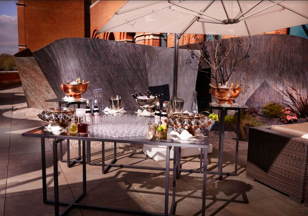 Hansom Hall outdoor catering setup with elegant drink stations for upscale events in London.