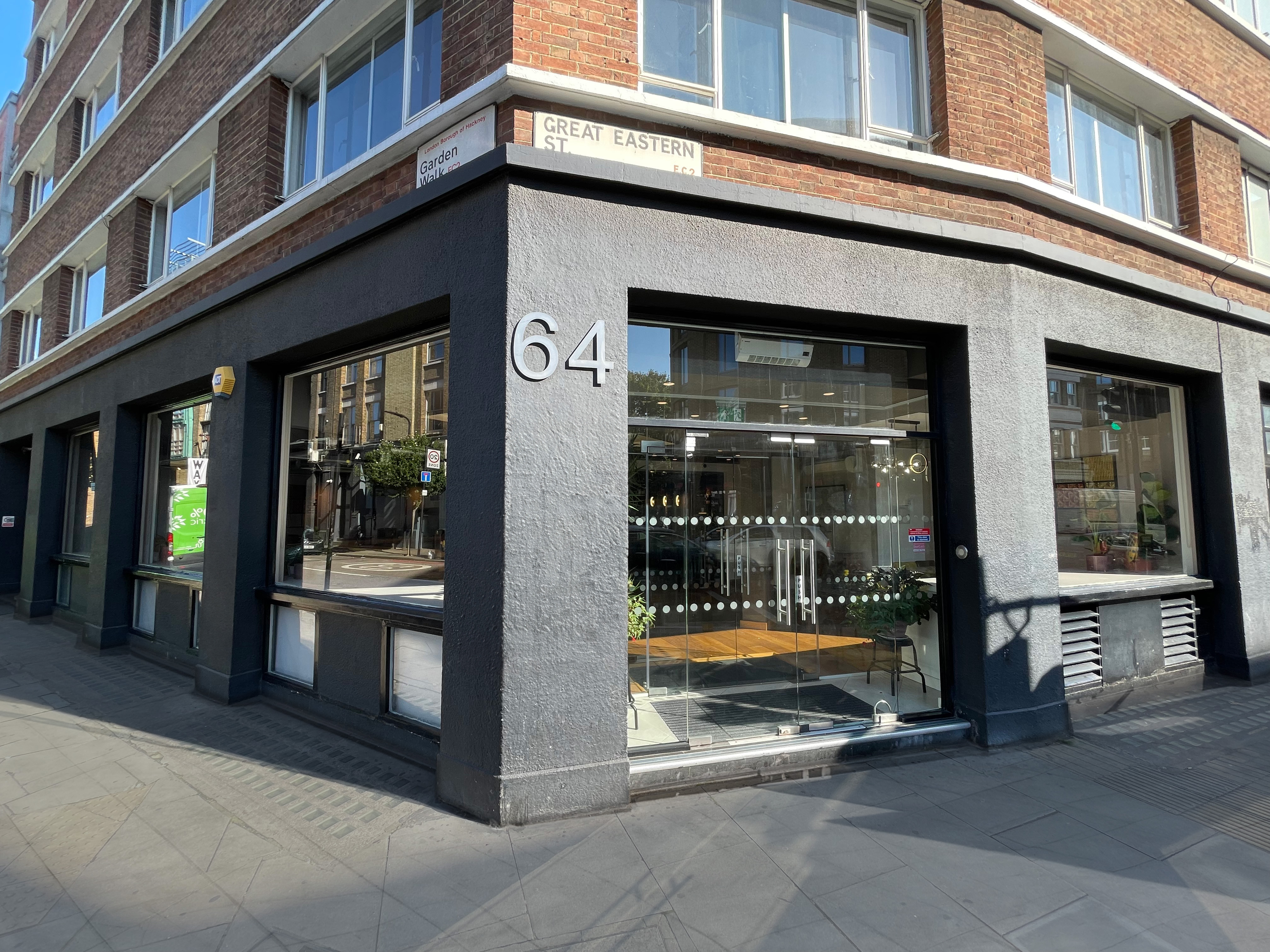 Modern venue with large glass windows, perfect for corporate meetings and events.