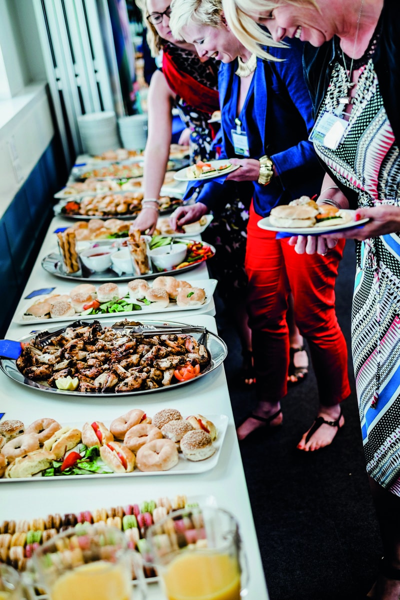 Buffet setup in Okuwura Hall for networking events and conferences, featuring diverse food options.