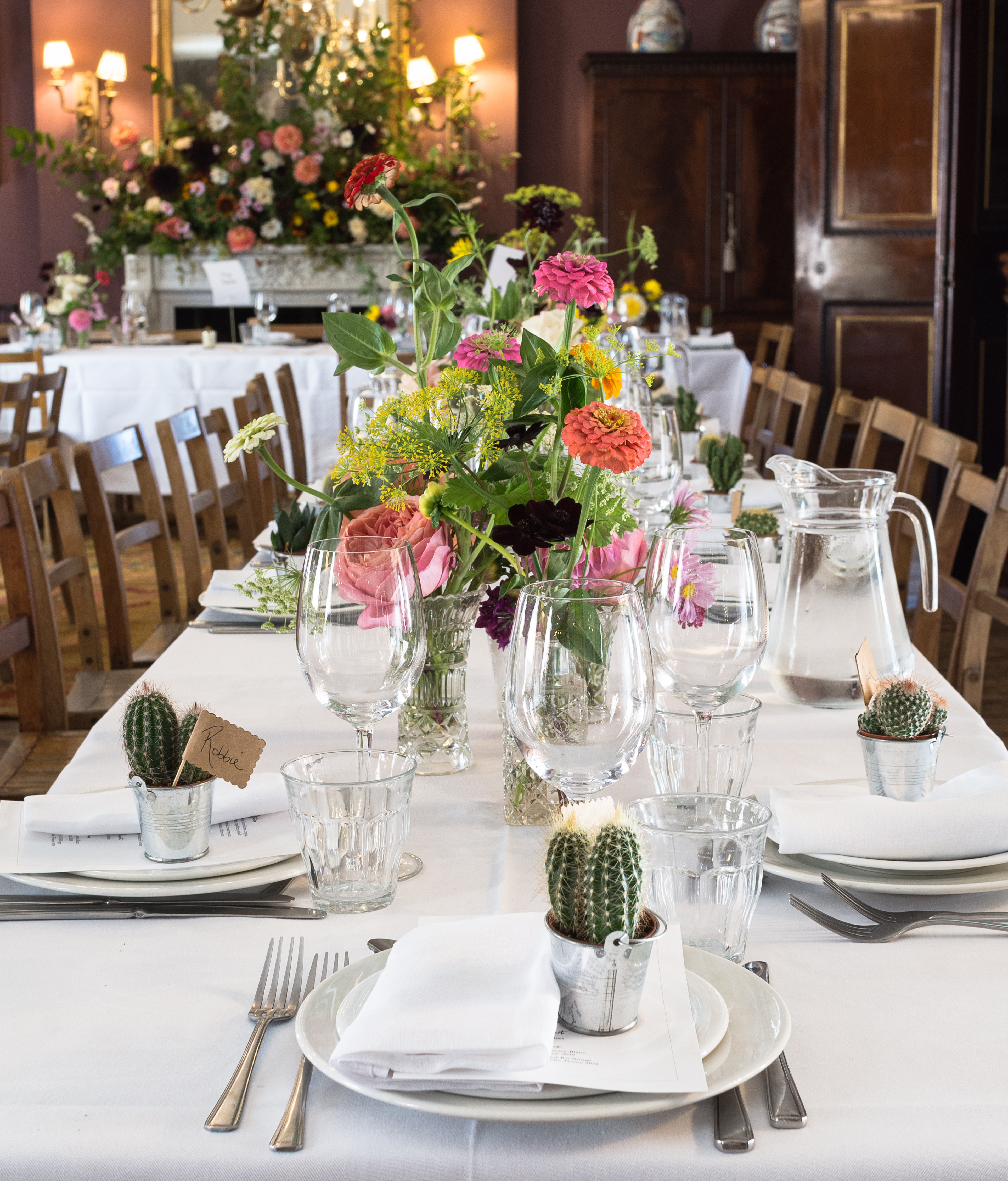 Elegant dining setup at Brunswick House with floral centerpieces for weddings and events.