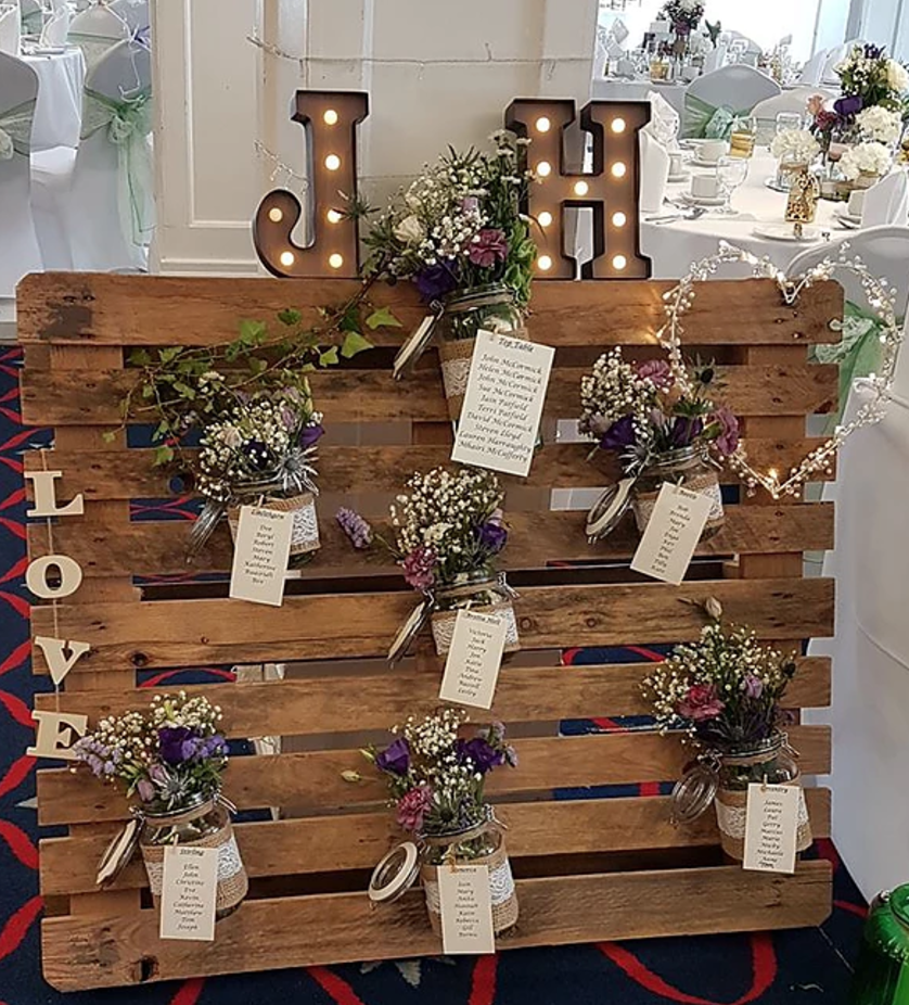 Spinnaker Function Suite wedding decor with rustic floral arrangements and personalized touches.