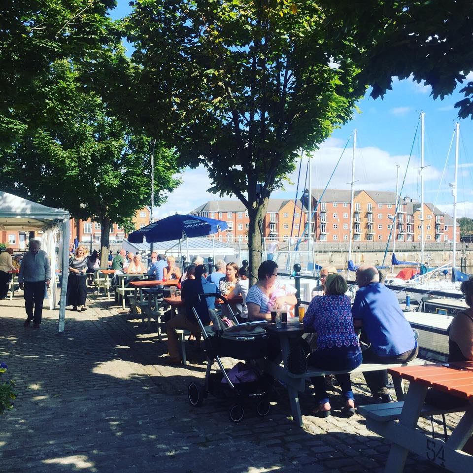 Outdoor dining area at Spinnaker Function Suite, ideal for summer networking events.