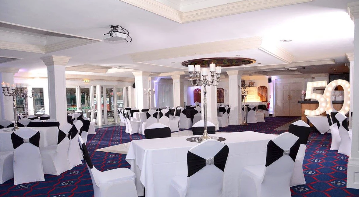 Spinnaker Function Suite with elegant black and white decor for corporate events and celebrations.