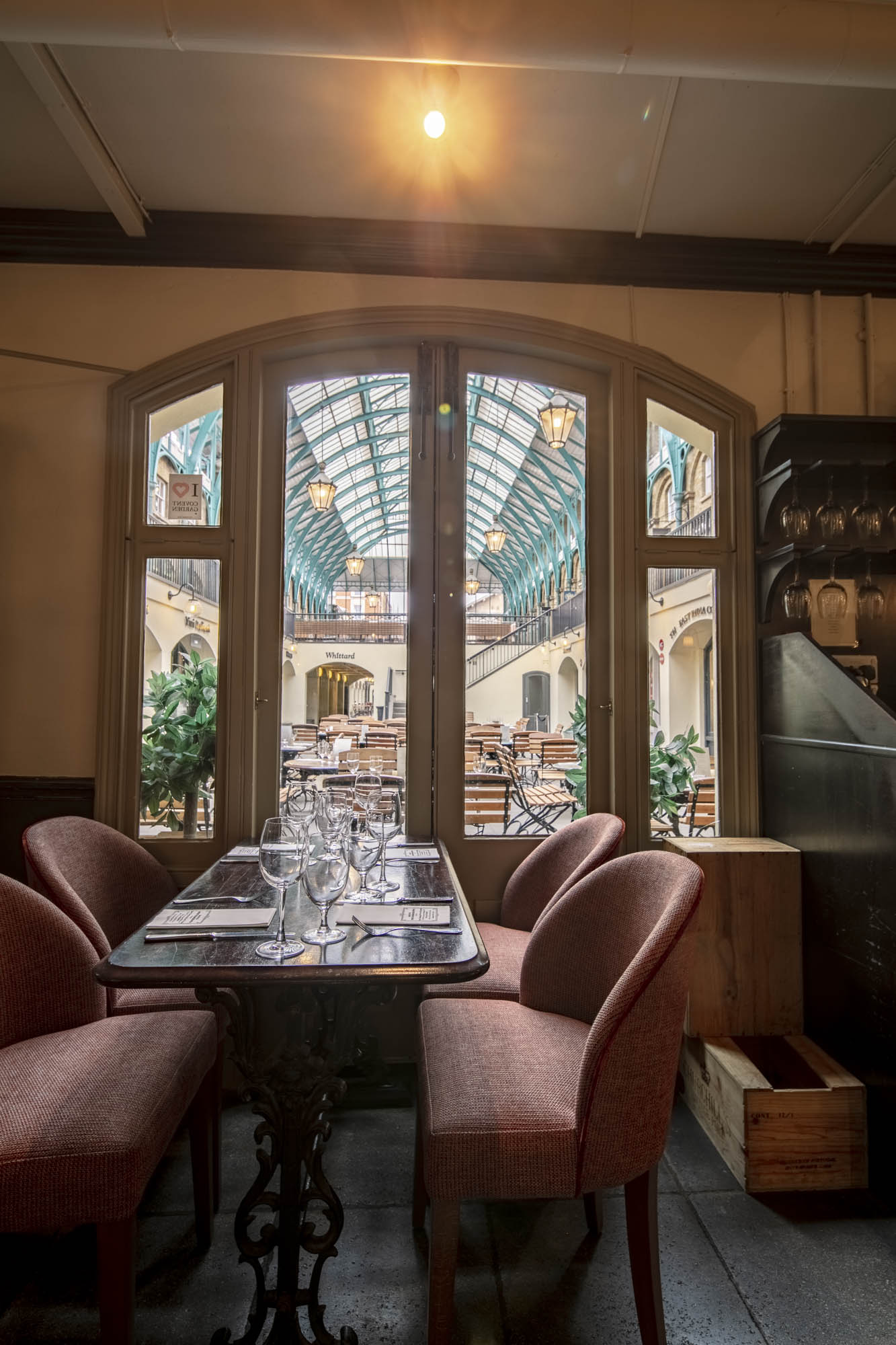 Elegant glass-roofed venue in Covent Garden for corporate events and celebrations.