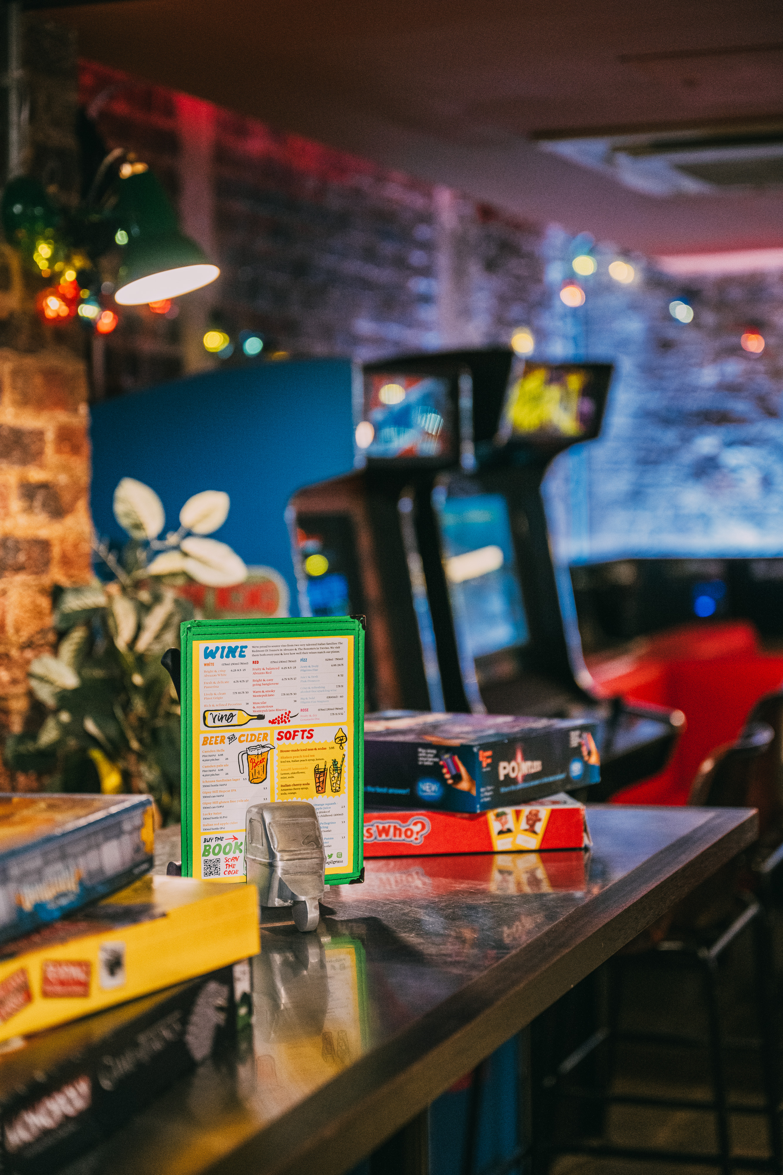 Vibrant Pizza Playground with arcade games, ideal for casual gatherings and team-building events.