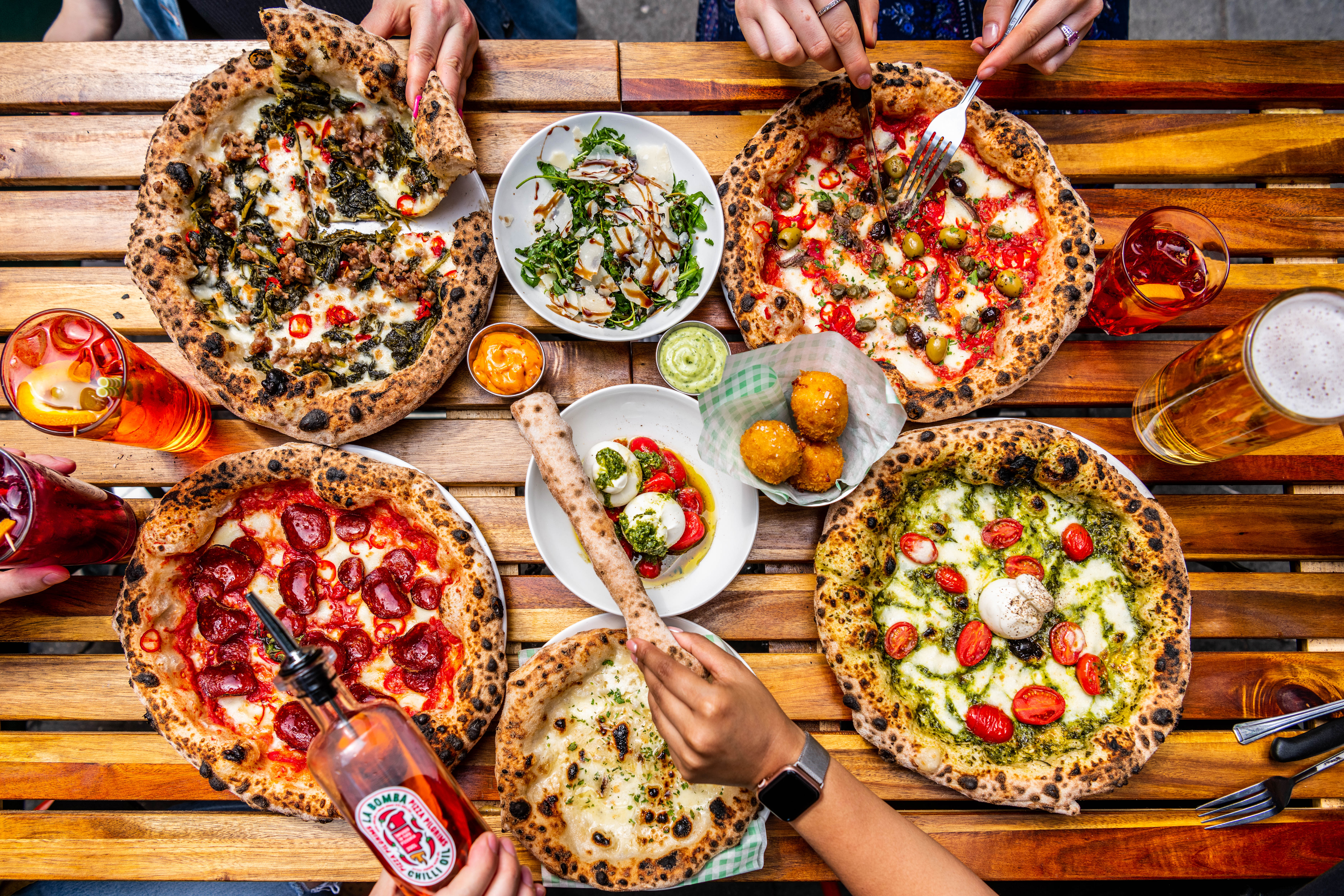 Gourmet pizzas at The Pizza Playground for casual networking events and team-building.