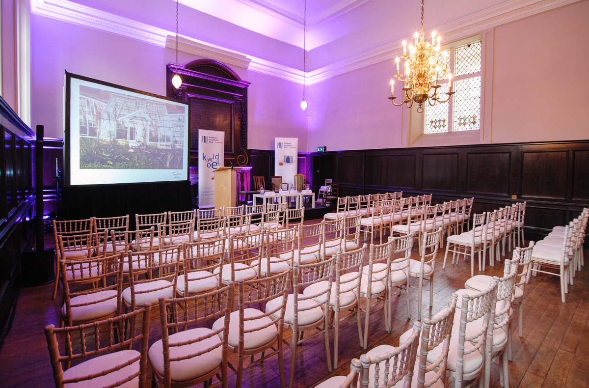 Elegant event space at Fulham Palace with wooden paneling for corporate meetings.