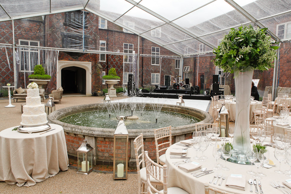 Elegant outdoor event space at Fulham Palace with a stunning cake and tented area.