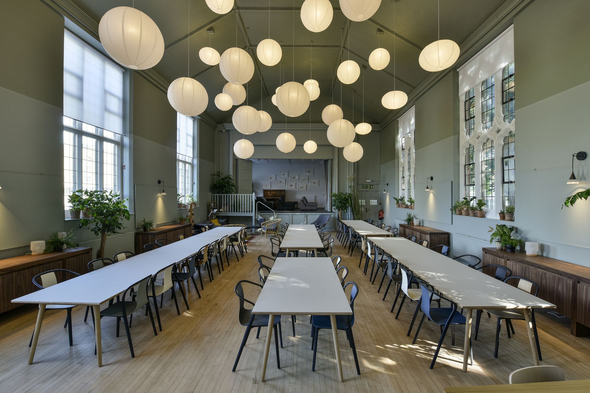 Spacious event venue with long tables, ideal for meetings and workshops at Refettorio Felix.