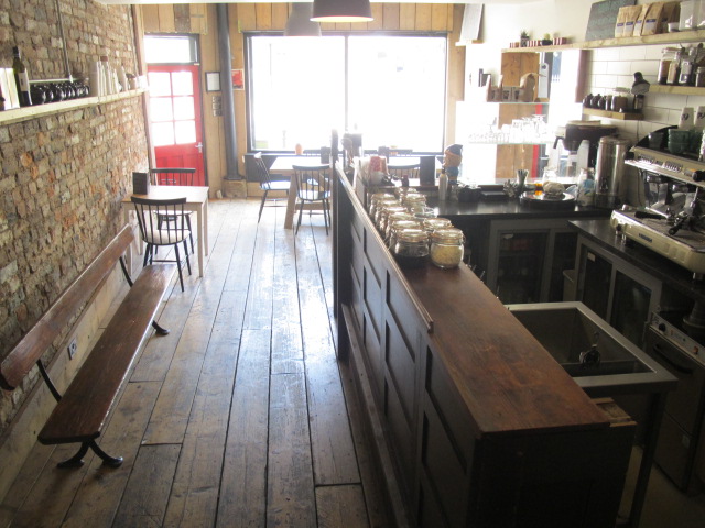 Cozy rustic venue with wooden floors for intimate meetings and small events.