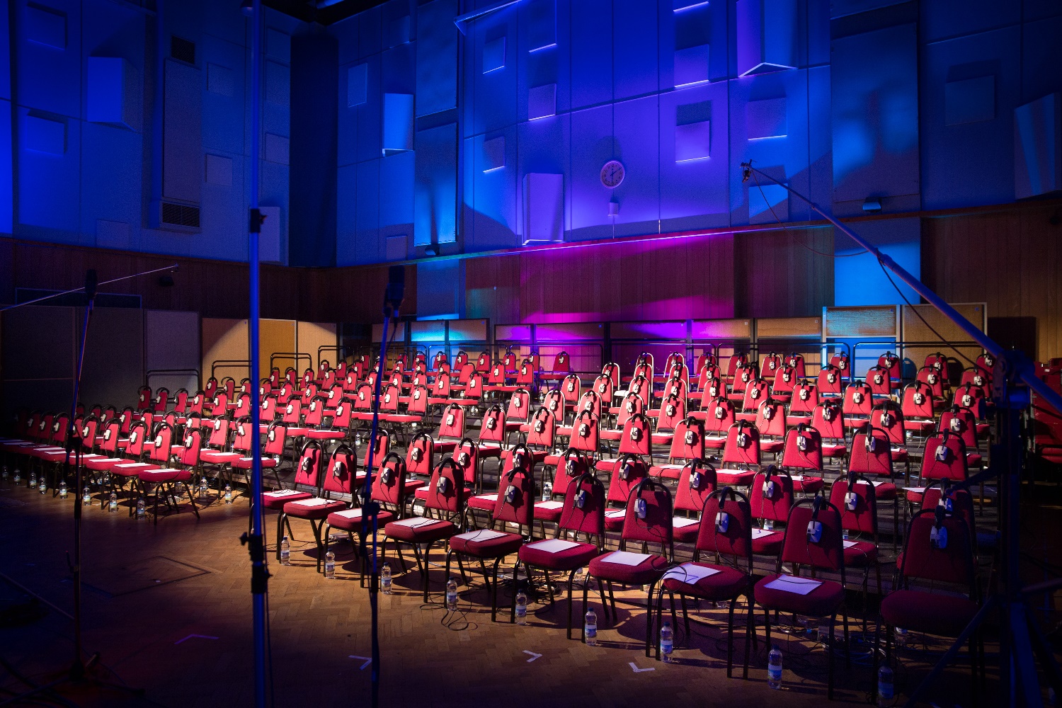 Abbey Road Studios' Studio One with red chairs for a multilingual conference setup.