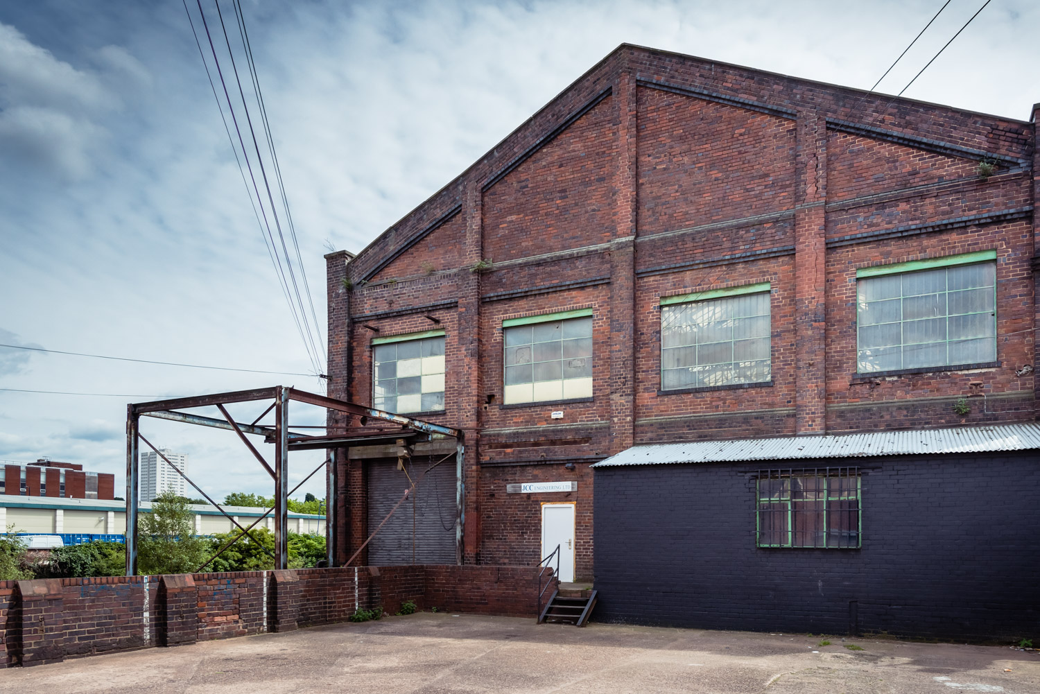 Rustic industrial venue with brick exterior, ideal for creative events and gatherings.