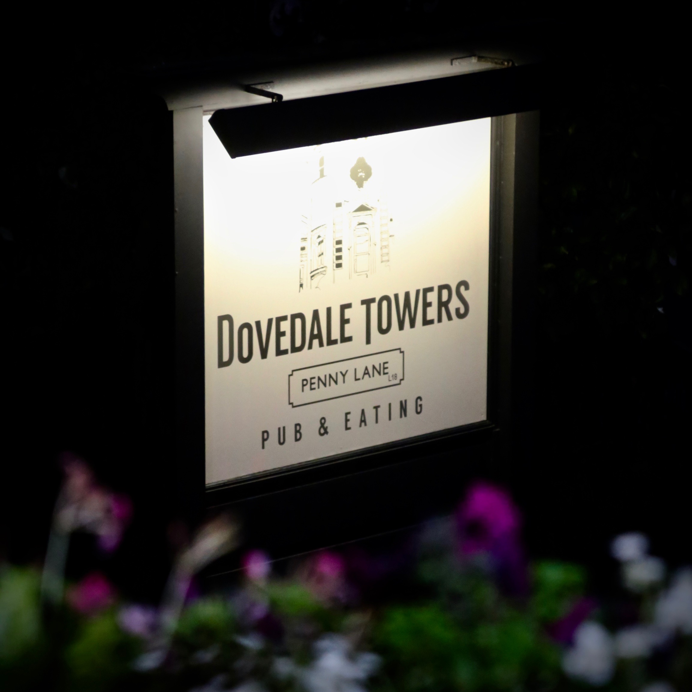 Welcoming sign at Dovedale Towers venue for casual gatherings and events.