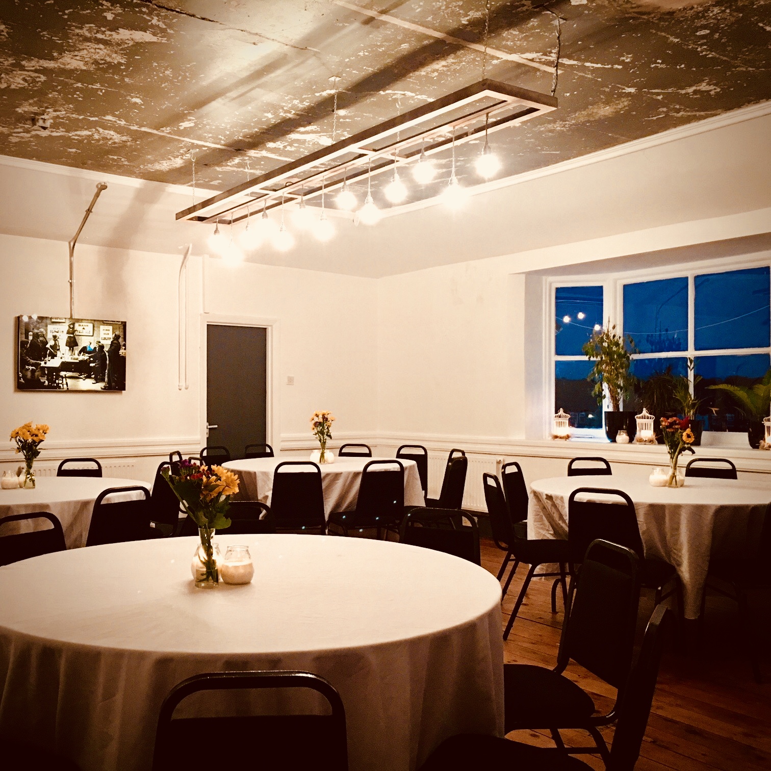 Whole Venue at Dovedale Towers with round tables, ideal for intimate gatherings and meetings.