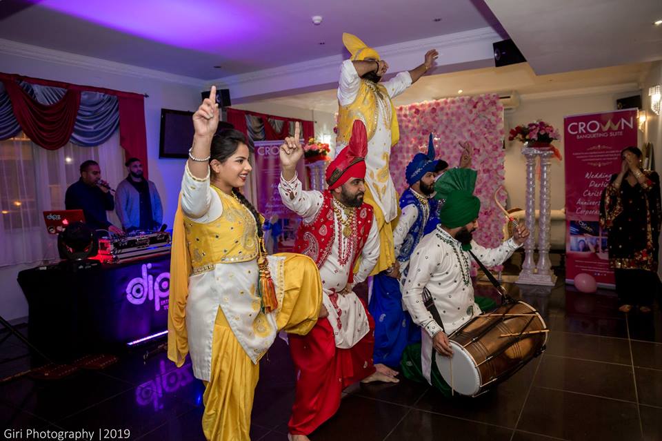 Vibrant cultural performance in Banqueting Hall, Crown Banqueting Suite, Ilford event.
