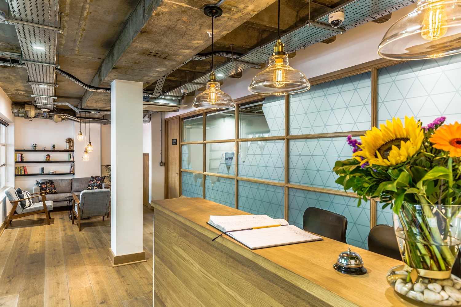 Modern reception area in The Glass Room, ideal for events and meetings with inviting decor.